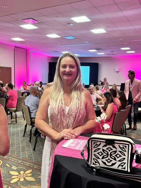 Cris of Cleaning Care Solutions smiling at a Cleaning for a Reason event
