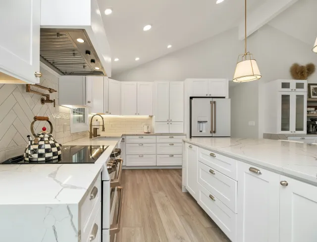 kitchen with white cabinets and marble counter tops
