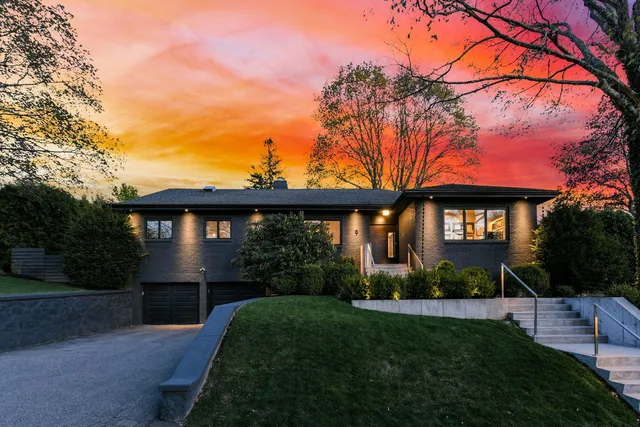 Completed modern home exterior at dusk