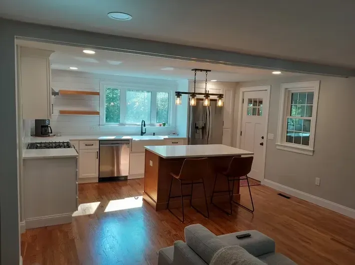 A kitchen with a large island in the middle of the room.
