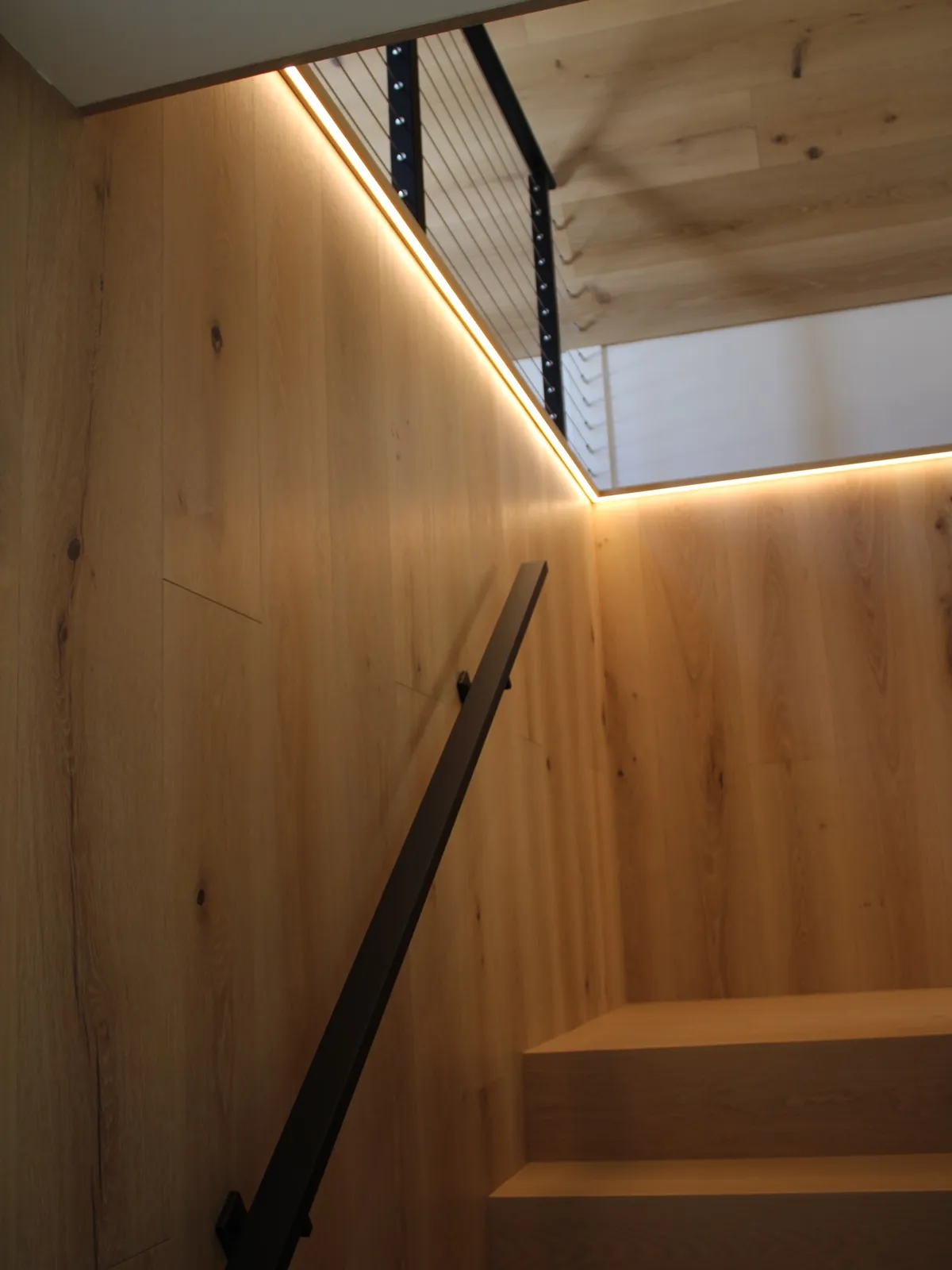 A quick preview of our “stairway to heaven” while we wait on the final edited photography from our Smithfield project. This white oak staircase features matching white oak paneling and a seamless one-piece tread-and-riser combination—crafted for continuity, precision, and longevity. We can’t wait to share the rest of this home with you and hear what you think.

#echelonbuilders #customhomes #customhomebuilder #luxuryhomes #whiteoak