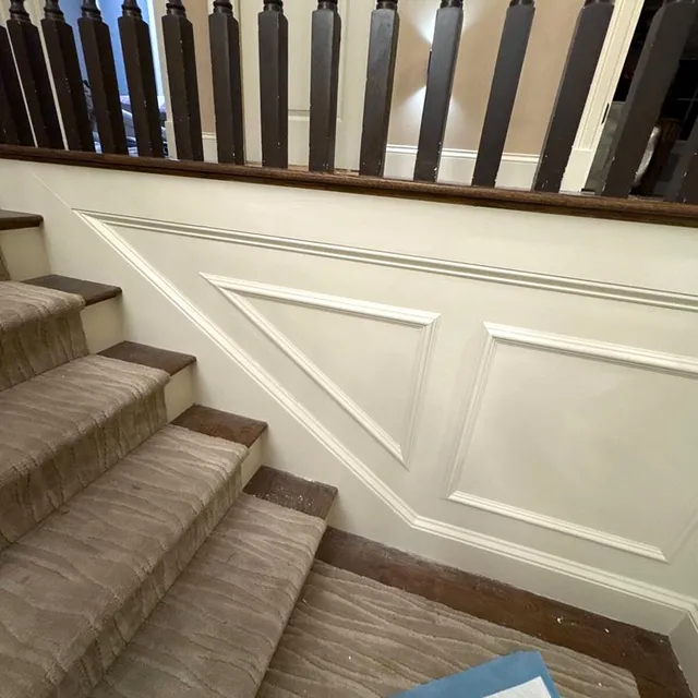 Wainscoting and millwork along a staircase