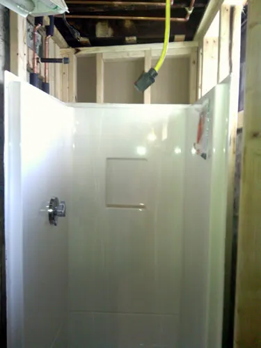 Shower surround set with supply rough-in behind