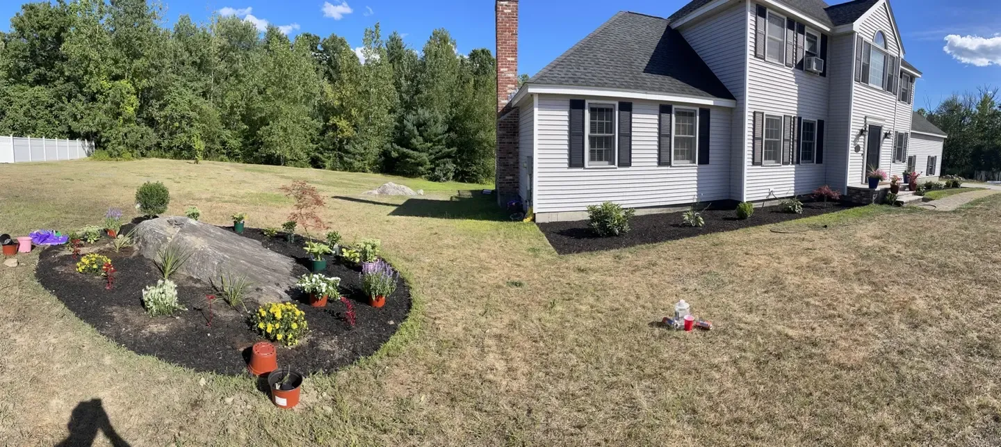 Panoramic view of the new foundation and boulder garden beds