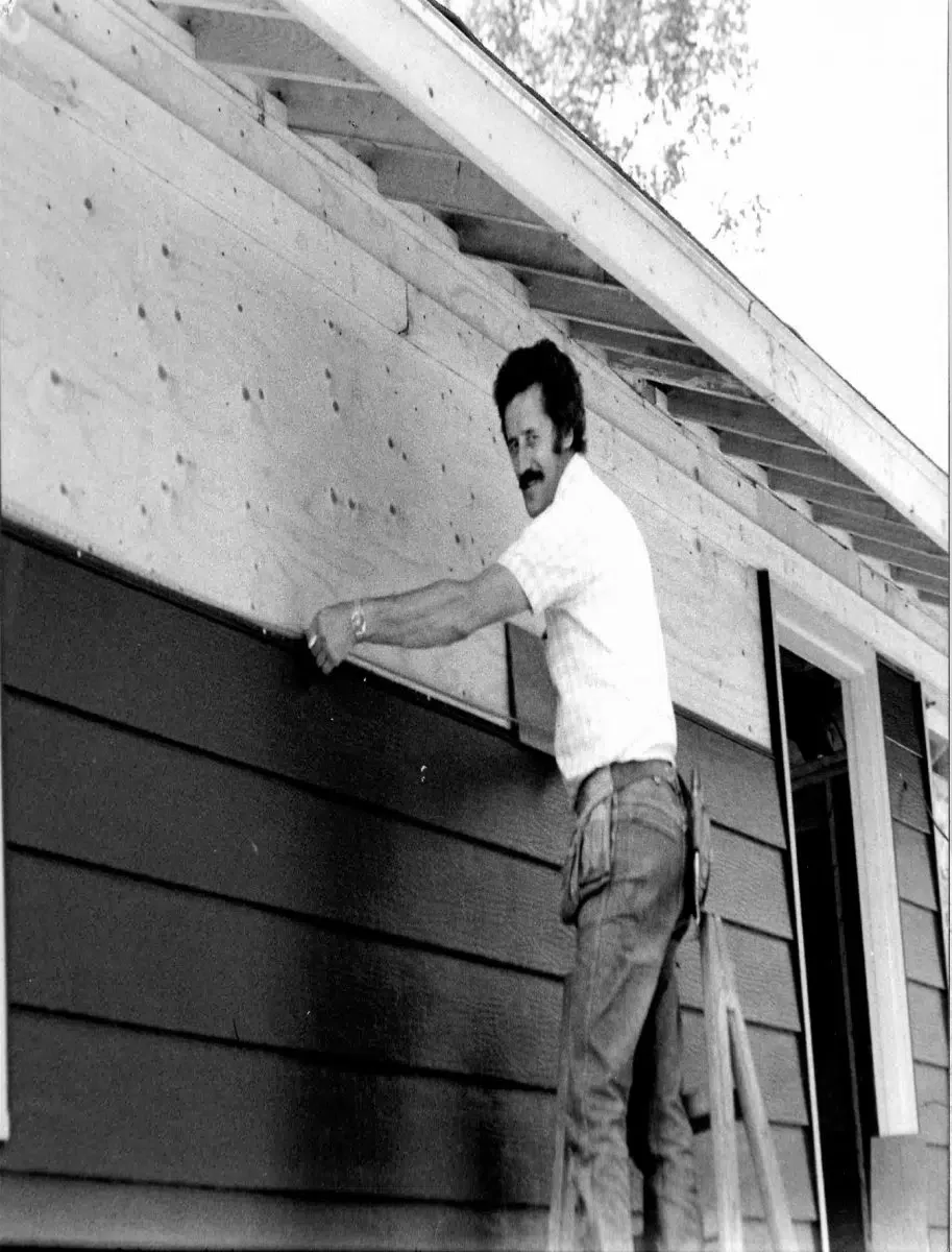 Phil Beaulieu putting up siding