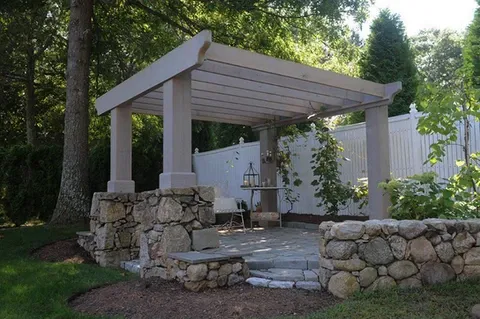 Large pergola with stone base