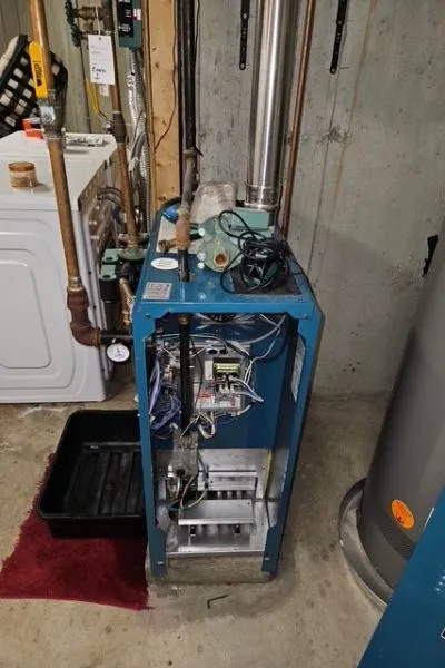 Basement boiler with exposed internal components