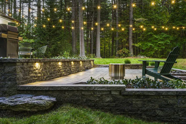 outdoor custom landscape stone patio design with lighting