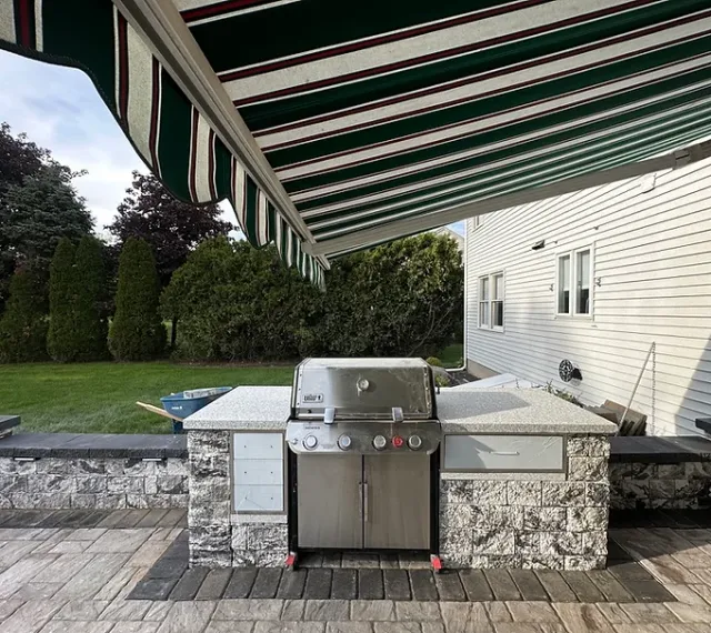 Custom stone barbecue grill built by Shkembi Masonry in Connecticut