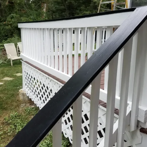 black rails and white banister, newly painted deck