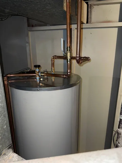 Water heater with copper supply lines and lever shut-off valve in a basement
