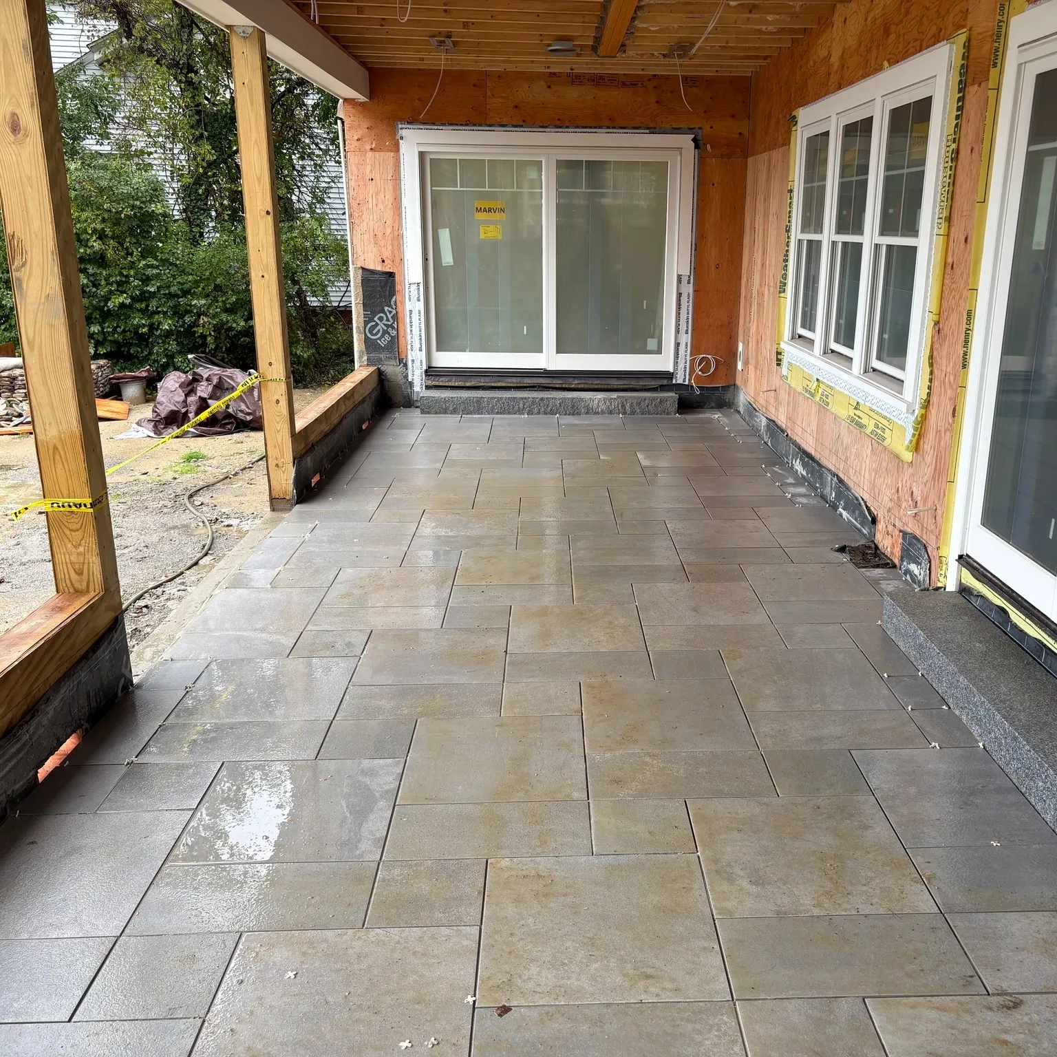 Newly installed stone patio outside residential home