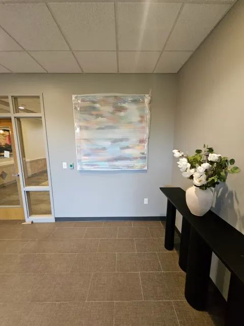 Finished commercial interior with painted walls and decorative artwork