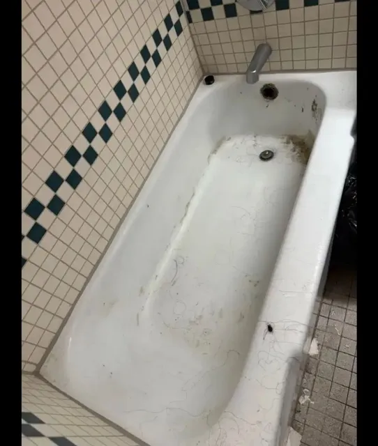 Stained bathtub before restoration cleaning