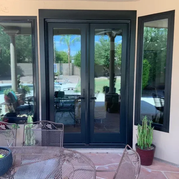 A renovated patio door on a concrete home