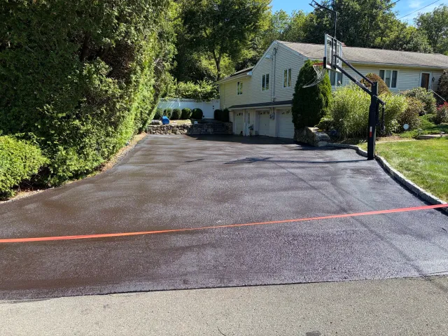 Completed residential driveway asphalt sealcoating in Monroe, CT