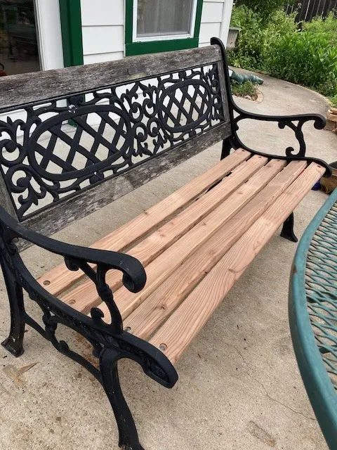new cedar seat slats on cast iron bench frame