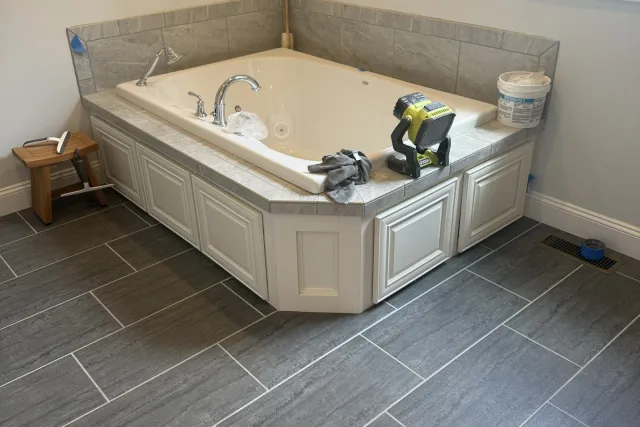 Wood-Look Plank Floor & Tub Deck tile installation in Newington, CT by Dmtilellc