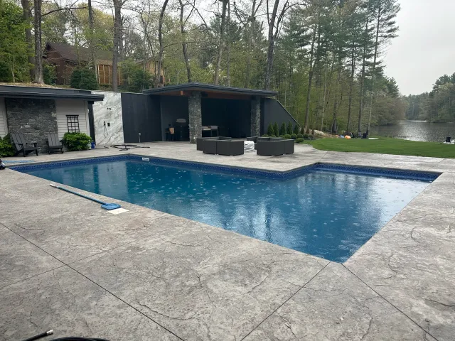 Custom L shaped inground liner pool designed and built by Rizzo Pools in Griswold Connecticut