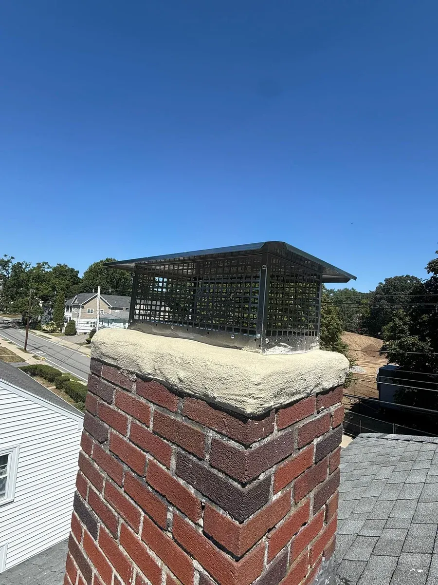 Chimney cap black steel blue sky — Chimney Goat project