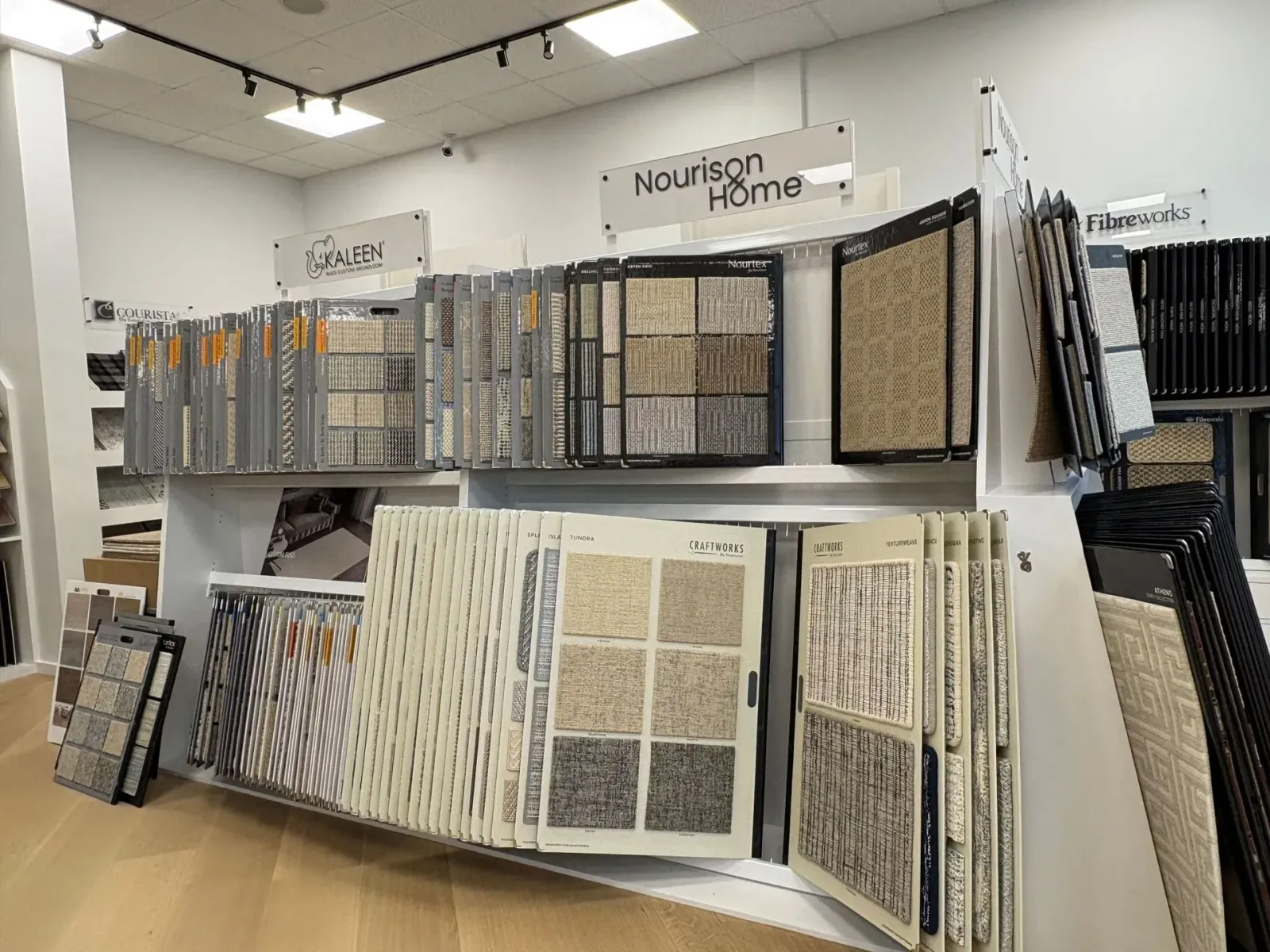Store display of tile and stone samples on racks in a bright showroom