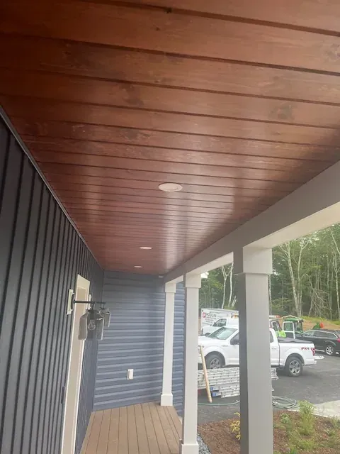 Stained wood porch ceiling on a finished exterior