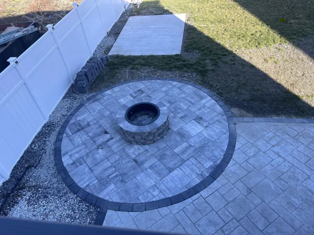 After: Circular fire pit patio with paver walkway