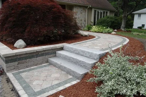 Paver walkway, granite steps and planted beds