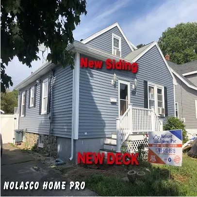A residential house with a visibly new exterior siding, displaying a clean, modern, and refreshed appearance that enhances its overall aesthetics.