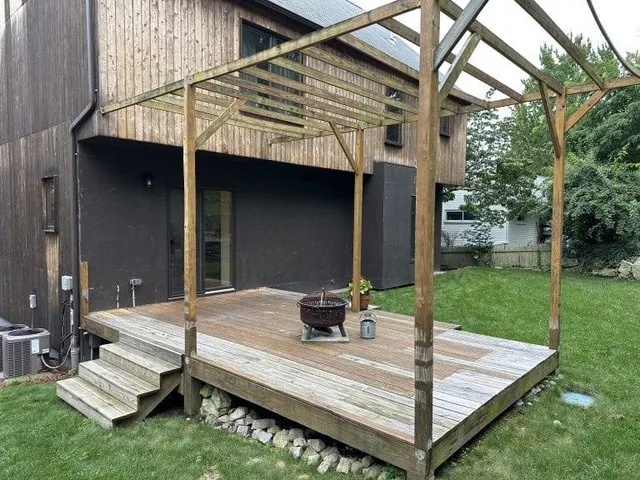 An image of a worn out deck that is about to be restored with hardwood materials by boston hardwood decks