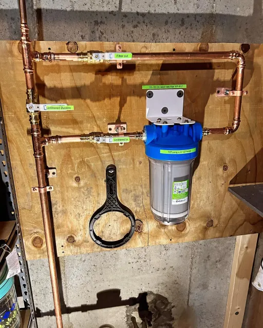 A copper pipe with a filter attached to it