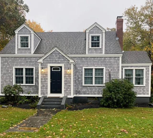 Brick house with siding instalation in worcester ma