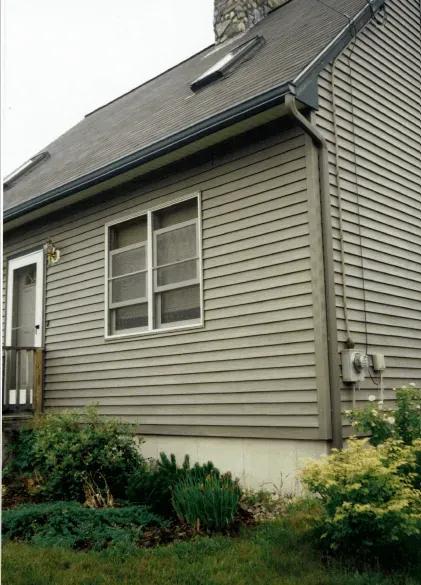 Man Cleaning The Gutter — Raymond, ME — The Gutter People