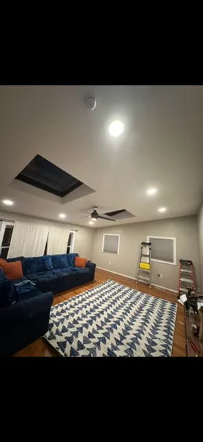 Boston Light & Power electrician installing tray ceiling and recessed lighting in Braintree, MA.