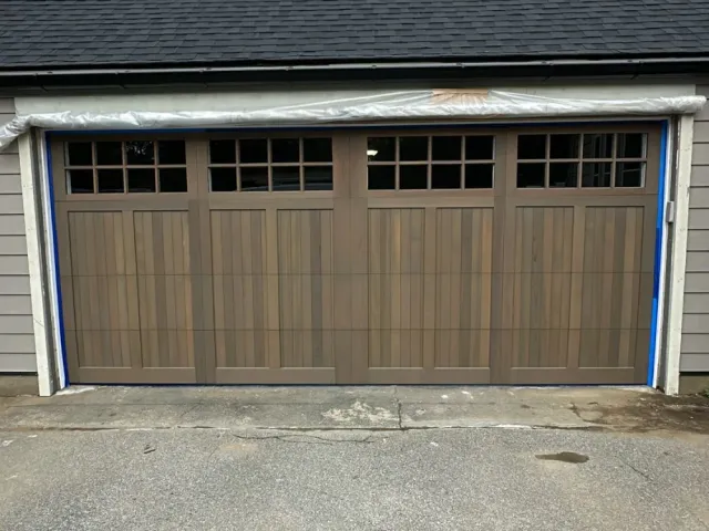 Garage door painting completed with a smooth, even exterior finish