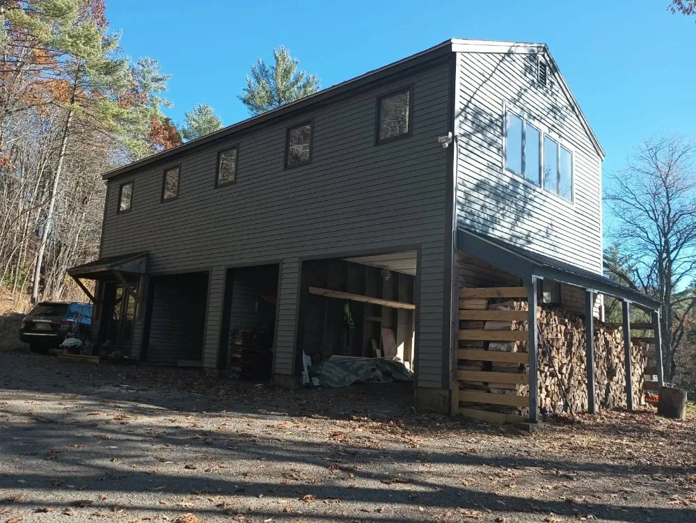 Completed exterior siding and trim project by Milena Construction