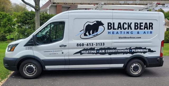 HVAC service vehicle for Black Bear Heating & Air, parked outside East Granby office.
