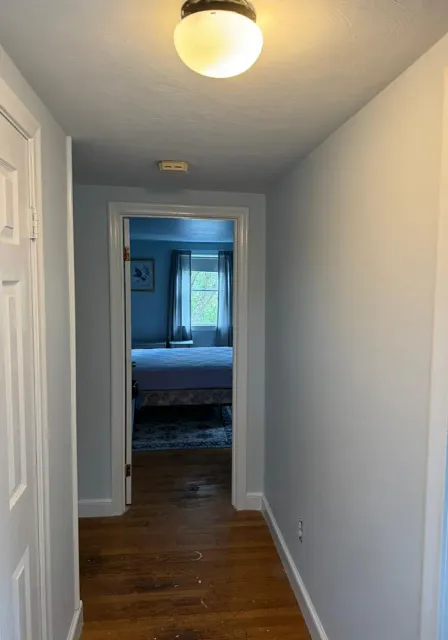 Hallway repaint with refinished hardwood flooring