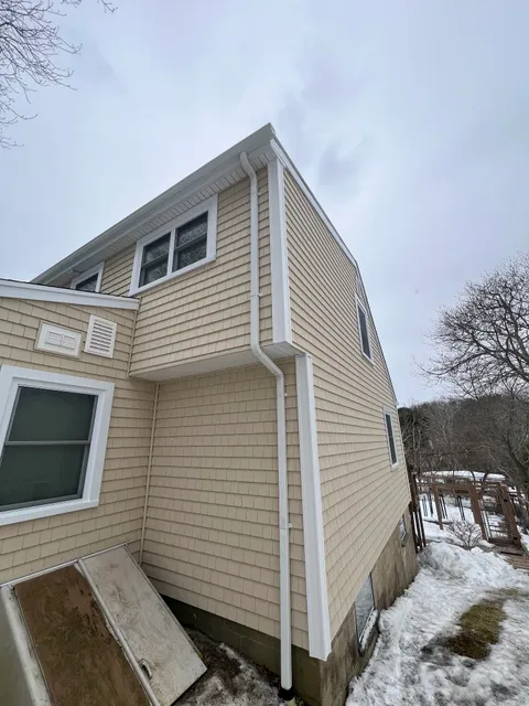 Detailed shake siding installation on a Plymouth home