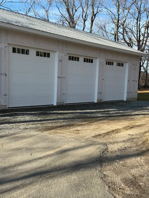 Carriage house garage door installed by J&A Overhead Door