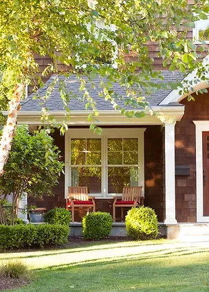Front porch with seeing and beautiful landscaping