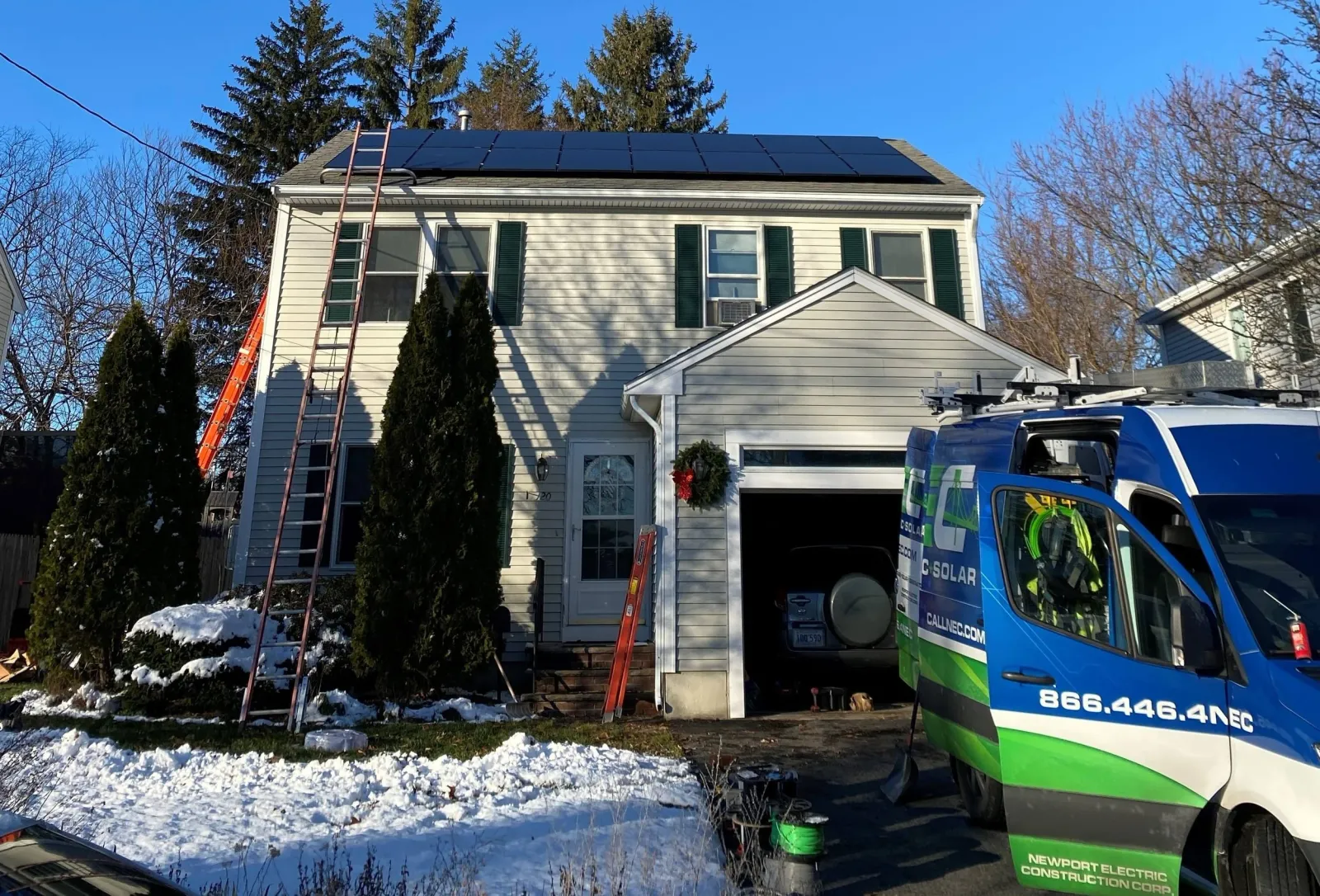 Residential rooftop solar array with the NEC van on site