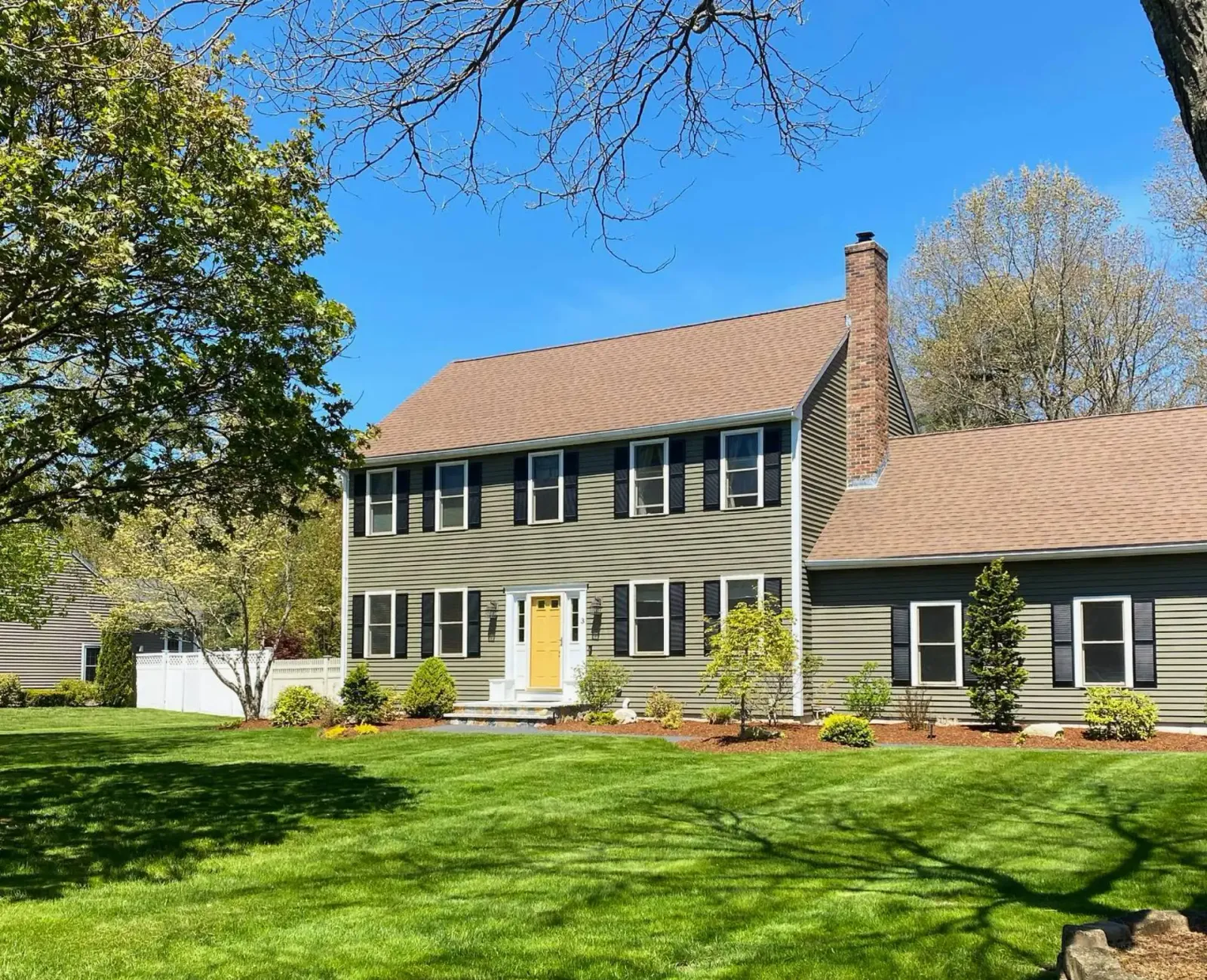 A green and well-manicured lawn with trimmed edges