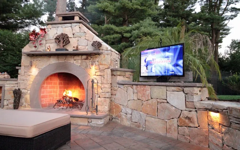 Outdoor stone fireplace and covered patio