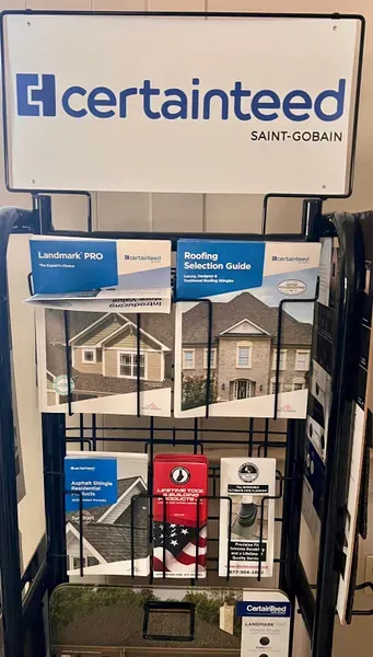CertainTeed display rack with roofing and siding product brochures in a showroom