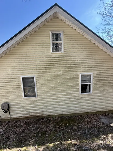Clean tan home gable after Eagle's soft wash