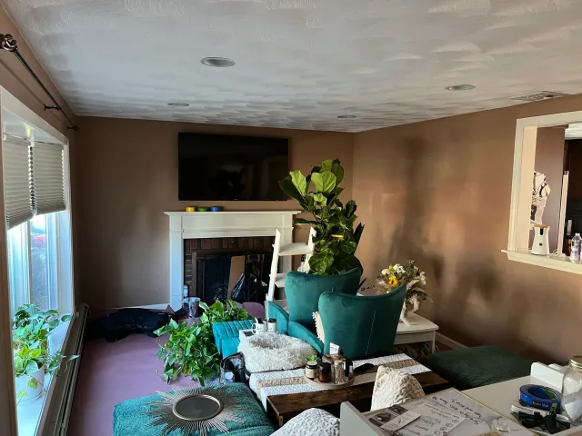Full room repaint with a forest green accent wall in Lynn MA by Slim's Painting