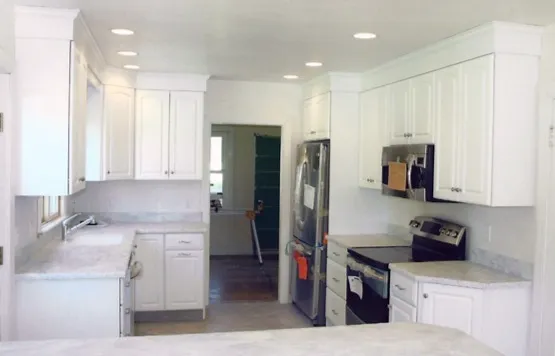 White kitchen remodel in progress, cabinets and counters set
