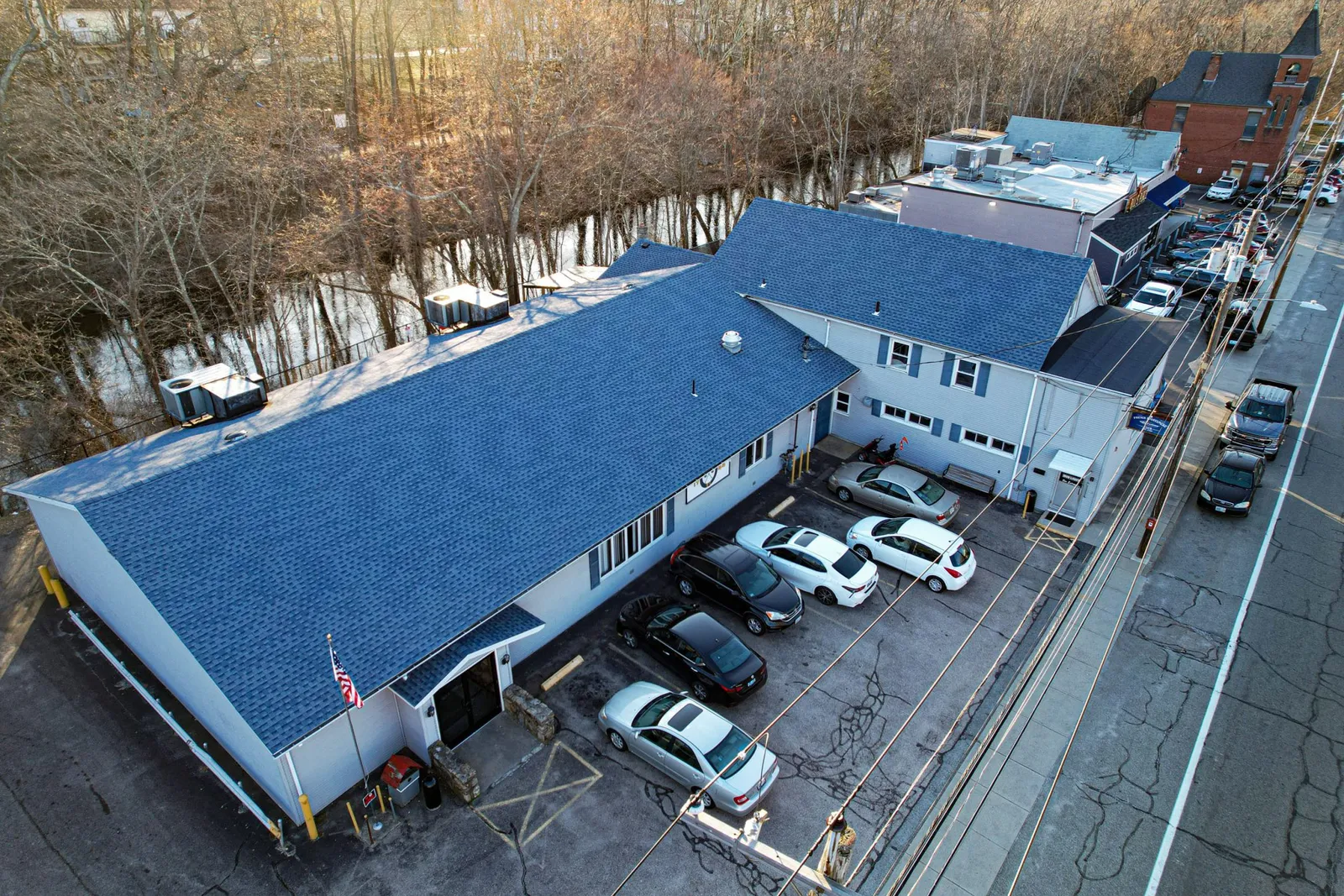 Aerial view of a commercial building with a newly finished low-slope roof