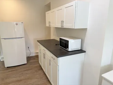 A kitchen in a Naugatuck home with cleaned counters and appliance fronts